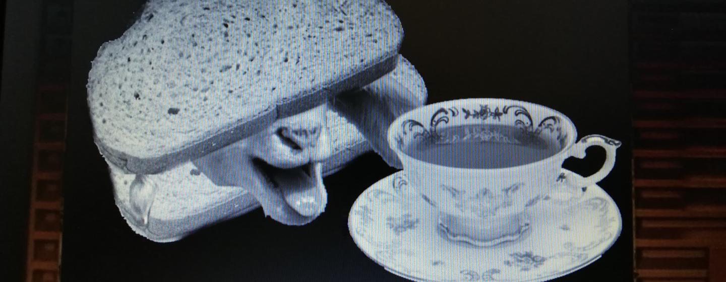 A collage of a cup of tea and a lambs head in a sandwich